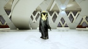 Fashion show in 3D: an invisible model in a long dress. black gold. Meta model, virtual avatar, walking by the podum. Trendy fashion pret-a-porte. 4K - Powered by Shutterstock - Get 15% off with code: PIKWIZARD15