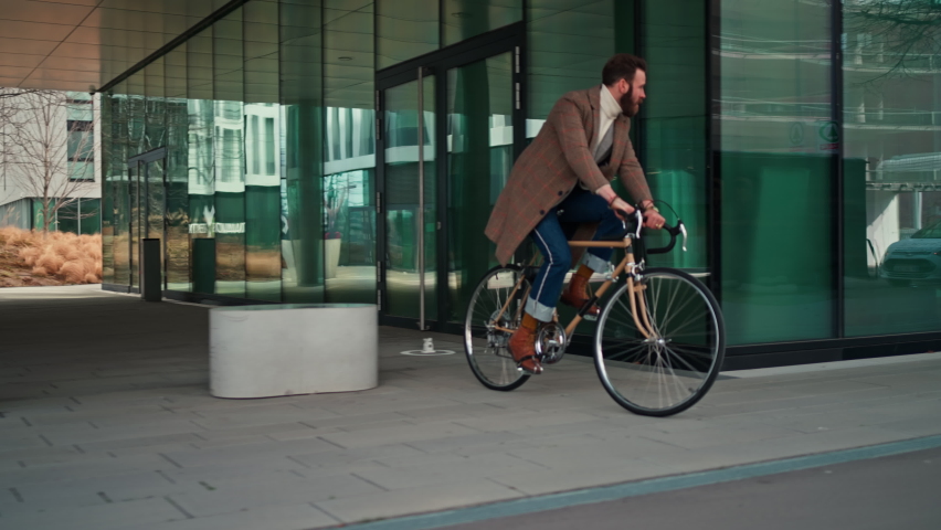 Stylish hipster man riding on vintage bicycle. follow camera, midsection shot Royalty-Free Stock Footage #1088726869