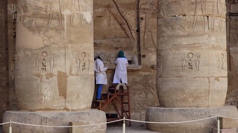 Luxor, Egypt - November 2021: Temple of Medinet Habu. The Mortuary Temple of Ramesses III at Medinet Habu is an New Kingdom period structure in the West Bank of Luxor in Egypt. Restoration.