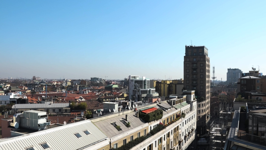 Panoramic view from rooftop of Milan Italy city life district and central area showing old buildings and tower cranes and background skyscrapers | Shutterstock HD Video #1088735725
