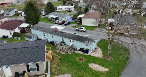 Rear of mobile home trailer house in USA. Aerial tilt down in America. Community living.