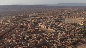 Zagora city and surrounding landscape. Morocco. Aerial circling