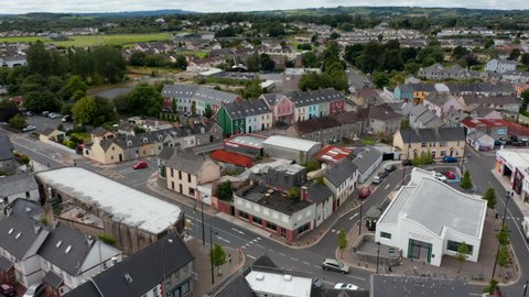 Aerial view of houses in town. Slide and pan shot of bright colour buildings in Carmody Street Business Park. Ennis, Ireland