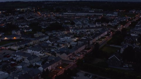 High angle view of rows of houses in residential urban neighbourhood at dusk. Low light city scene. Killarney, Ireland