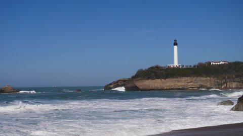 Beautiful beach in Biarritz city with the lighthouse in the background