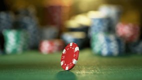 Poker chip rotating on casino table in super slow motion, filmed on high speed cinema camera at 1000 fps. Gambling background. - Powered by Shutterstock - Get 15% off with code: PIKWIZARD15
