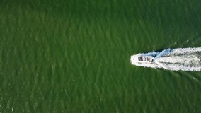 4k drone footage of a lone boat on a river in Suffolk, UK