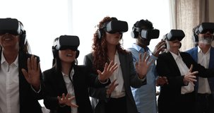 Multiracial teamwork having fun wearing augmented reality headset inside business office - Metaverse concept