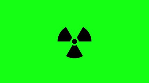 Animation of a black radiation sign symbol on a green background, pulsating from the center of the picture to the viewer