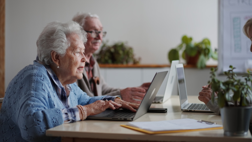 Senior group in retirement home learning together in computer class Royalty-Free Stock Footage #1088766453