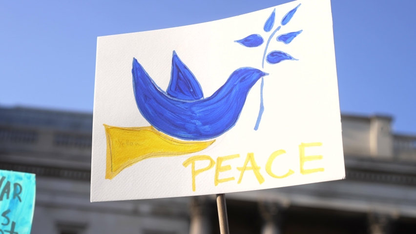 London stands with Ukraine, blue and yellow dove, protester sign of peace in Trafalgar Square in London during protest against war with Russia Royalty-Free Stock Footage #1088767199