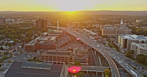 Hartford Connecticut Aerial v18 pan shot capturing traffics on u.s. route 6 second longest transcontinental highway and nearby neighborhoods at sunset - Shot with Inspire 2, X7 camera - October 2021