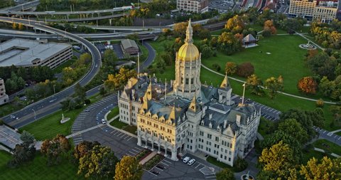 Hartford Connecticut Aerial v15 establishing shot birds eye view pan around capitol building, tilt up reveals downtown cityscape at sunset golden hours - Shot with Inspire 2, X7 camera - October 2021