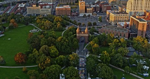 Hartford Connecticut Aerial v17 birds eye view overlooking memorial arch at bushnell park, tilt up reveals downtown cityscape at sunset golden hours - Shot with Inspire 2, X7 camera - October 2021