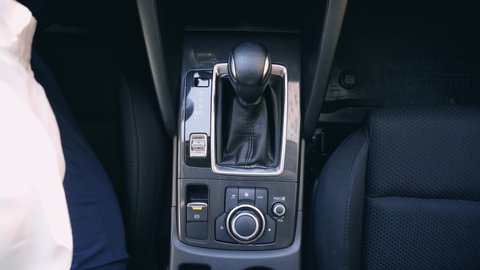 Close-up Of Person's Hand Changing Gear While Driving Car. Top View.gear, shift, car, african, change, automatic, hand, american, driver, transmission, knob, people, stick, control, engine, lever, man
