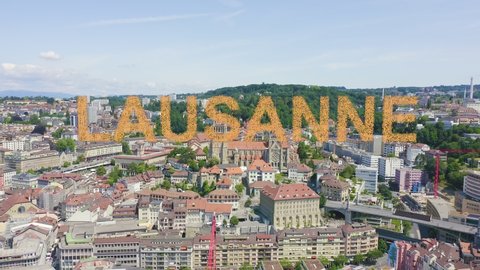 Inscription on video. Lausanne, Switzerland. Flight over the central part of the city. La Cite is a district historical centre. Appears from the sand, Aerial View