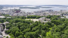 Inscription on video. Oslo, Norway. Royal Palace. Slottsplassen. Palace park. Appears from the sand, Aerial View, Point of interest