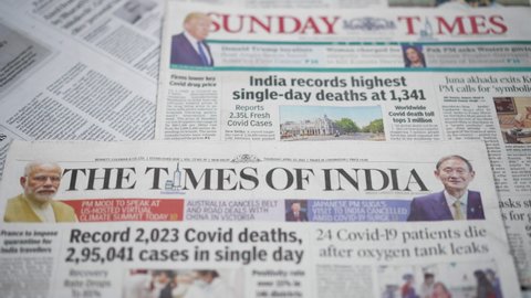 Dehradun, Uttarakhand India-May 05 2021- Newspaper Headlines about Record 3 Lac approx Covid-19 or Coronavirus cases in a single day in India. Rising cases of Covid19. The second wave of Coronavirus.