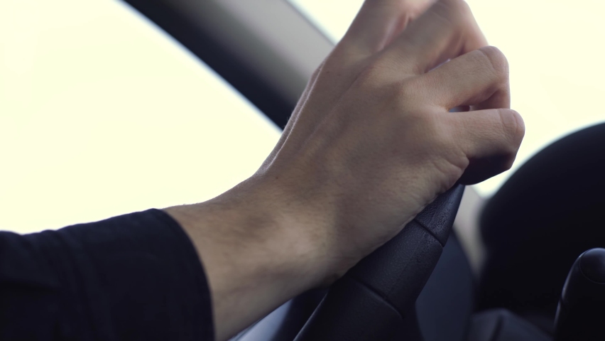 Man driving car nervously taps his finger on the steering wheel.  Royalty-Free Stock Footage #1088777881