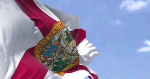 The state flag of Florida waving in the wind. Florida is a state located in the Southeastern region of the United States. Democracy and independence. Seamless looping in slow motion