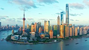 Aerial footage of modern commercial buildings and skyline in Shanghai at sunset, China. World famous city skyline in Shanghai. 