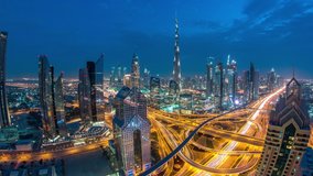 Modern skyscrapers and busy evening highways day to night transition timelapse in luxury downtown of Dubai city. Top aerial view from tower rooftop. Road junction traffic. Fisheye lens. Dubai, United - Powered by Shutterstock - Get 15% off with code: PIKWIZARD15