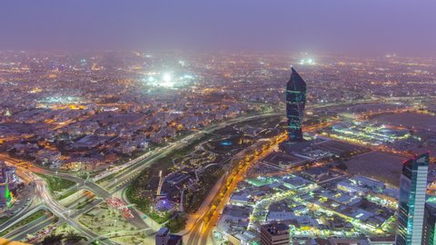 Kuwait City cityscape from top day to night transition timelapse with traffic on streets and highway. Illuminated towers. Located on the shore of the Persian Gulf.