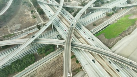 LOS ANGELES, CA, USA - March 15, 2022: Drone 4k. Aerial view Los Angeles. Intersection of highway freeway roads in LA. California commute drive in urban modern city in America.