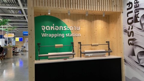 BANGKOK, THAILAND - Circa March, 2022: Wrapping station at IKEA Store Bang Yai inside Central Plaza Westgate. Self service paper wrap for IKEA customers. Delivery service waiting area in background