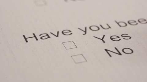 Filling Out Yes In A Selection Box Of A Feedback Survey Papers. Close Up