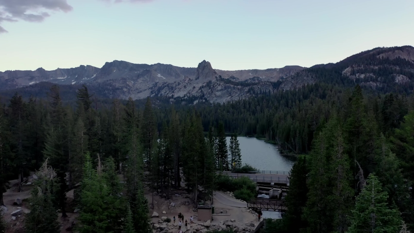 Tranquil Scenery Of Mountains With Dense Conifer Forest At Twin Lakes In California. Aerial Pullback