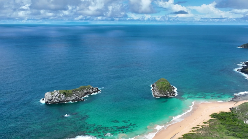 Seascape volcano mountains and beach at archipelago of Fernando de Noronha Brazil. Tropical volcano islands at Fernando de Noronha archipelago. Vacation travel. Tropical destination.