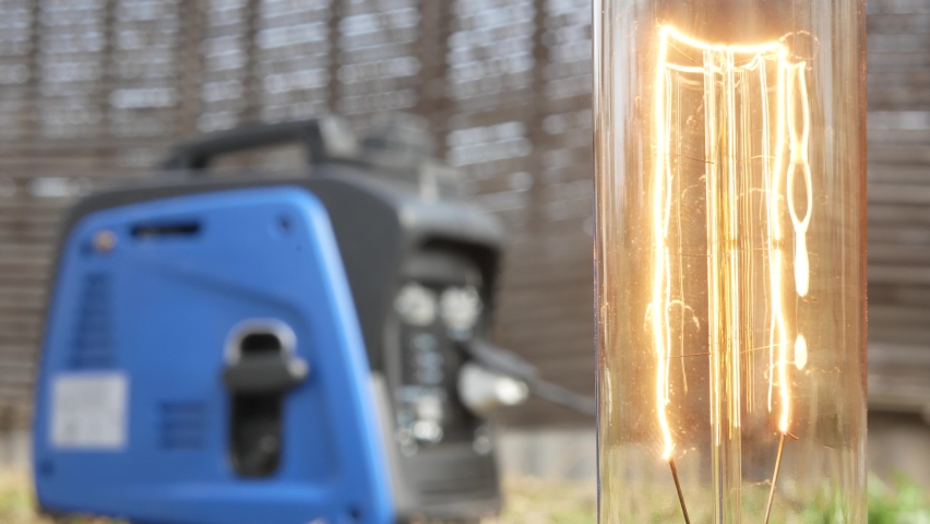The incandescent light comes on when a person starts a gasoline generator.