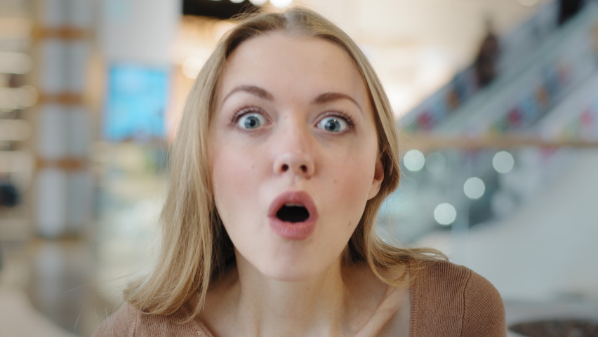 Excited girl close-up madly surprised opening mouth young woman amazed incredibly impressed wow effect unexpected news lady smiling broadly glad big sale huge discounts female nods head in agreement Royalty-Free Stock Footage #1088804507