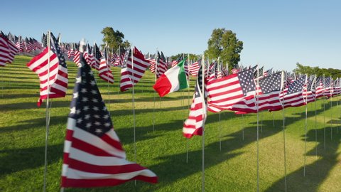 Memorial at Pepperdine University, Malibu, September 2021. Patriotic memorial display within picturesque countryside. Aerial flags representing 9-11 terrorist attack victims. High quality 4k footage