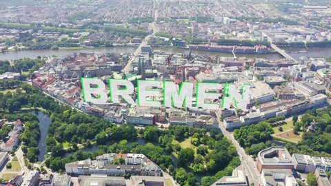 Inscription on video. Bremen, Germany. The historic part of Bremen, the old town. Bremen Cathedral ( St. Petri Dom Bremen ). View in flight. Glitch effect text, Aerial View, Departure of the camera