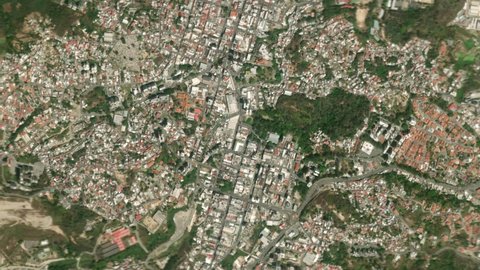Earth zoom in from space and focus on Los Teques, Miranda, Venezuela. The animation continues by zoom out through clouds and atmosphere into space. Background for travel intro.
