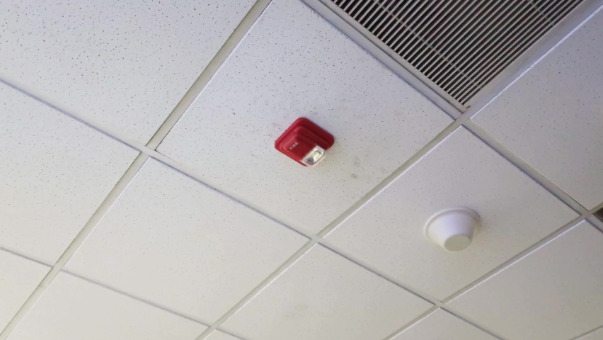 Fire Alarm Detecting Fire on Office Floor with Emergency High Frequency Sound and Light.