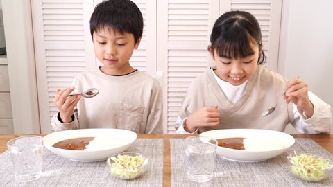 Japanese children eating curry rice