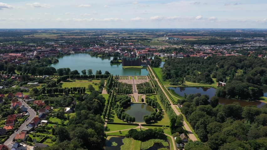 Aerial View Of Frederiksborg Castle, Park, Lake, And Garden In Hillerod, Denmark. - pullback