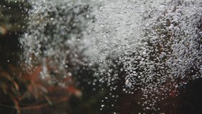 air bubbles in water filmed in slow motion video 