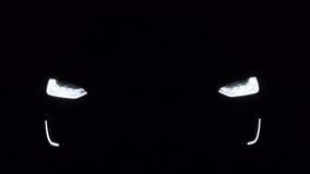 car working lights. 4K video. flashing turns. Footage how the lights of an electric car shine