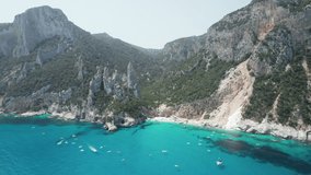 Aerial drone video of tropical paradise turquoise beach in the mediterranean, Cala Goloritzè