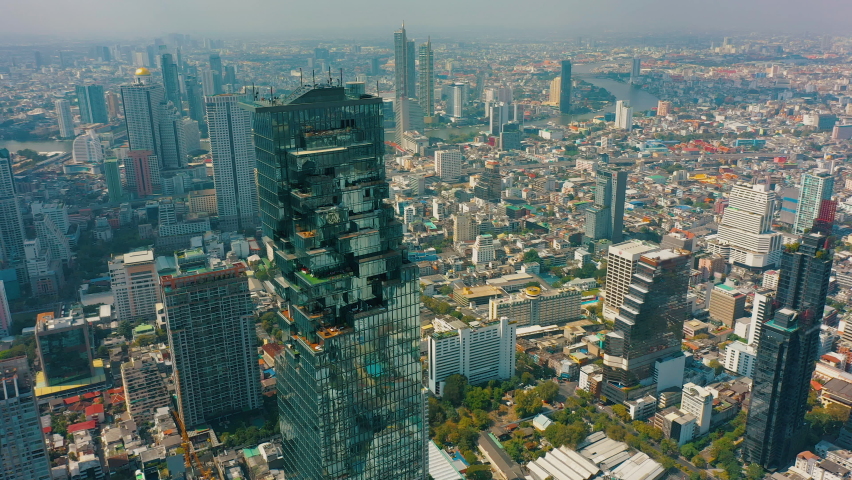 Aerial view of Bangkok business district, downtown of BKK, Thailand. Financial district and city center, skyscrapers and high-rise office buildings, cityscape  Royalty-Free Stock Footage #1088833093