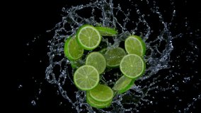 Super slow motion shot of rotating exploded lime slices with splashing water on black at 1000fps. - Powered by Shutterstock - Get 15% off with code: PIKWIZARD15