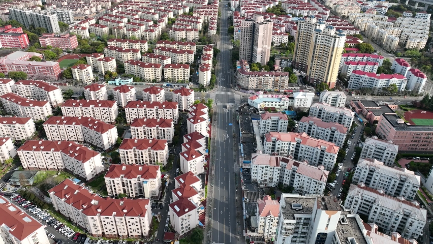 Drone aerial view of Empty Shanghai city during lockdown March 28 2022. Coronavirus, lockdown and news concept b-roll footage. No people and traffic in the road during the first day of Pudong lockdown Royalty-Free Stock Footage #1088840859