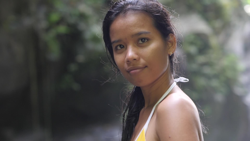 Portrait of an Asian woman in a bikini at summer day.