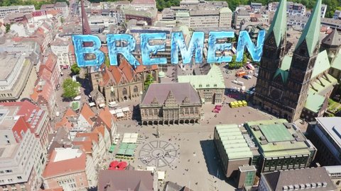 Inscription on video. Bremen, Germany. Bremen Market Square ( Bremer Marktplatz ), Bremen Cathedral ( St. Petri Dom Bremen ). View in flight. Arises from blue water, Aerial View, Point of interest
