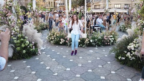 TIMISOARA, ROMANIA - April 20, 2019: TIMFLORALIS international flower festival. People and tourists are enjoying the flower decorations in the city center