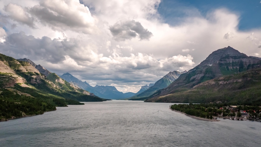 Timelapse of Waterton Lake, town and mountains